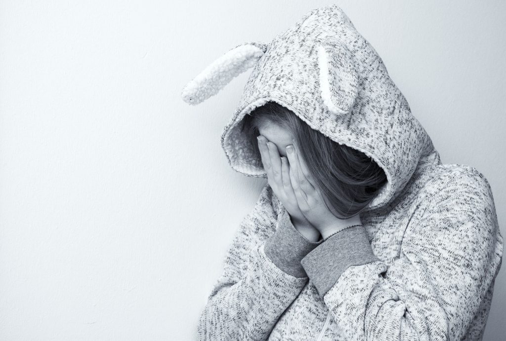 Girl suffering from social stigma.